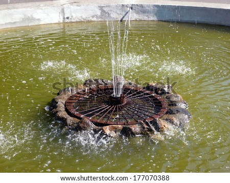 one round fountain at summer sunny day