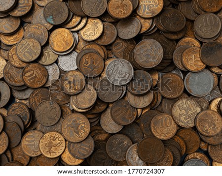 Background of old coins in low key. Old Russian coins, rubles and pennies.
