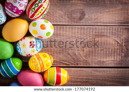 Easter eggs on wooden background  Royalty-Free Stock Photo #177074192