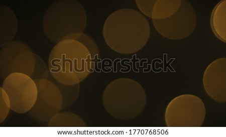 Natural Gold Color Bokeh Particles Effect Photo Overlays Background Glowing Abstract Lens Lights Defocused Circles and Blur Golden Glitter Beautiful Glamour Style. Use Screen Overlay Mode.