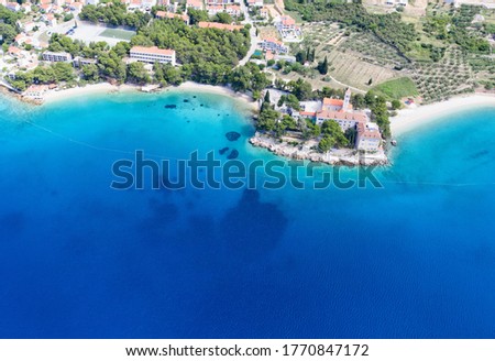 Aerial view on amazing beautiful beach and the small church of St.Ivan and Teodora on Island Brac,Bol.Copy space image