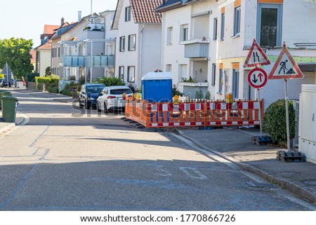 Construction site with barricade in a side street