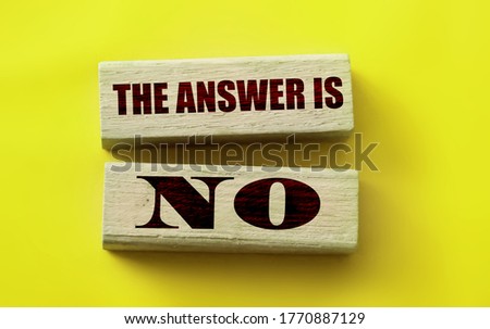 The answer is No on Wooden Blocks on yellow background. Business or relationship sponsorship concept.