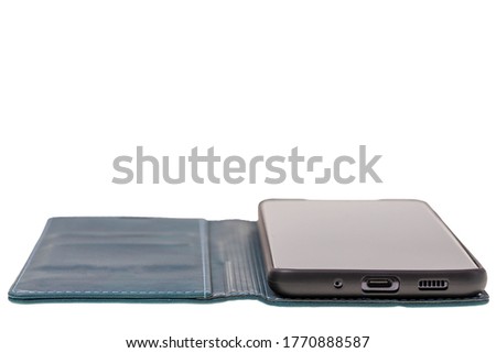 Close up view of mobile phone in green case isolated on white background. Communication concept.
