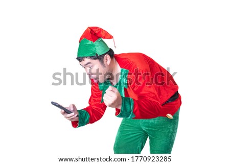 Asian men dressed as clowns He is using a smartphone to shopping online. He is happy to have a product that is pleasing and cheap. On white background and clipping path.
