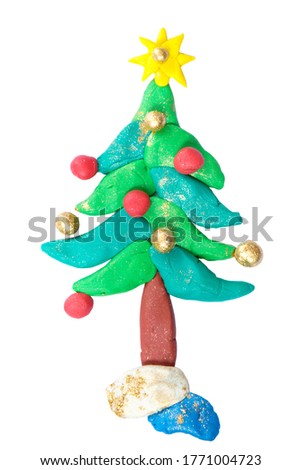 Plasticine christmas tree with star isolated on white background. Gold and red christmas ball. Kids artwork.