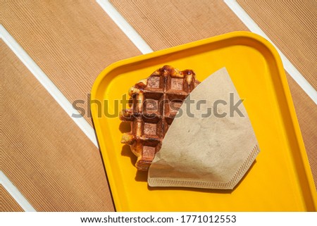 Cafe waffle on the yellow tray