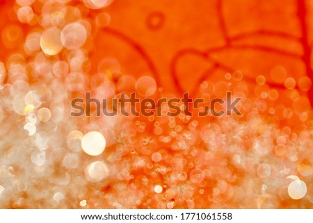 Blurred images and bokeh made from water droplets in orange tones