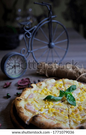 A closeup shot of a tasty looking pizza on a wooden table