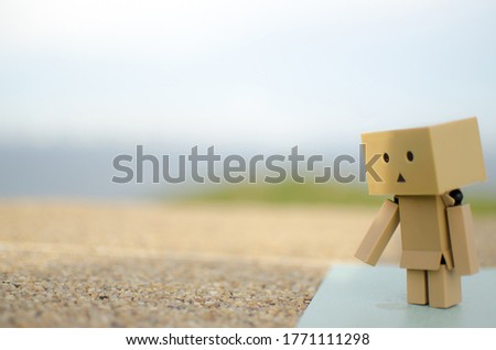 Danboard is sad in the rainy atmosphere.