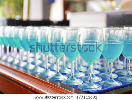 Row of blue curacao cocktail.
