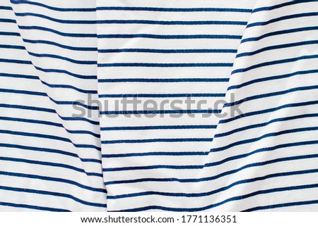 Blue and white stripes on the knitted fabric