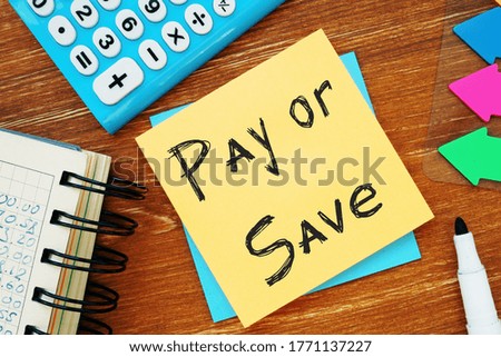Business concept about Pay Or Save with sign on the piece of paper.
