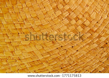 background of beautifully interwoven straw with an empty place for text