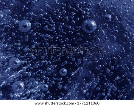 beautiful texture and details photo of bubbles in ice