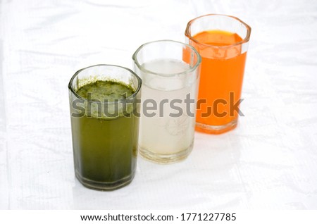 the indian flag from orenge, lychee, and green mint juice in the memorial day or veteran's day.