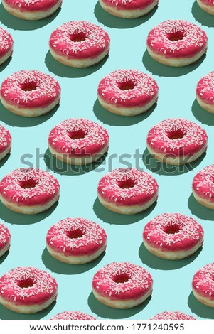 pattern with pink donuts on a green background