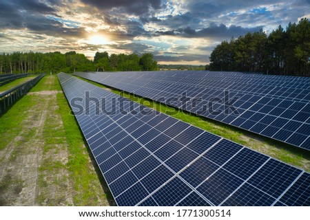 Solar panels in nature. Green renewable energy of the sun. Royalty-Free Stock Photo #1771300514