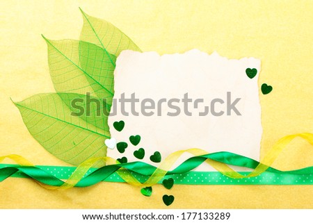 Valentines day card. Old paper with decorations on yellow background. Stock photo