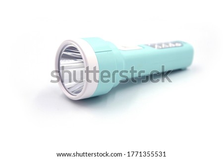 Pocket lighter on white background. Pale blue led light perspective view. Modern lantern with front and handle light. Camp travel equipment. Handy lantern studio photo isolated. Plastic pocket lamp