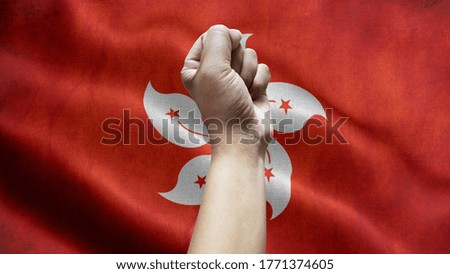 Man Hand Isolated on the background of the flag of Hong Kong