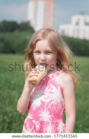portrait of a little five year old girl in the park
