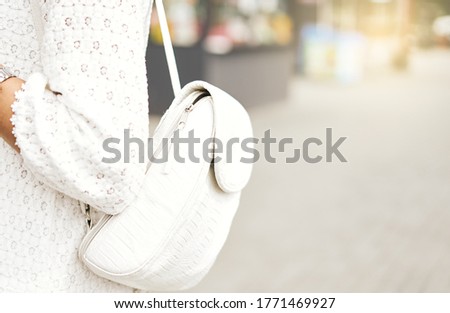 Back to school, Back of college student with backpack while going to university by walking from street, defocused out of focus