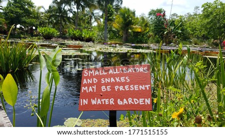 Danger sign at water garden