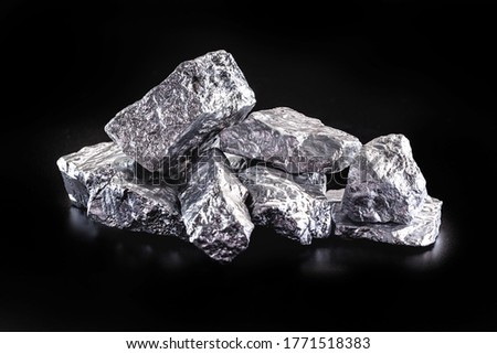silver nugget native to Liberia isolated on black background. Rare stone for industrial extraction ore Royalty-Free Stock Photo #1771518383