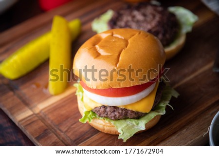 burger on wooden cutting board