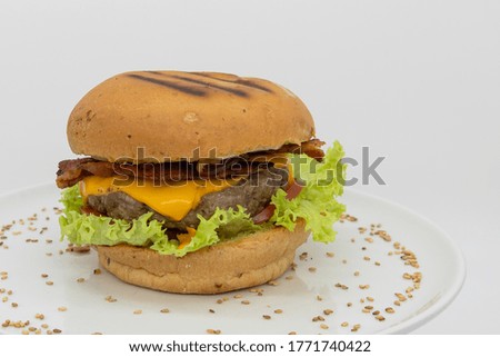 beef, bacon and yellow cheese burger in white background