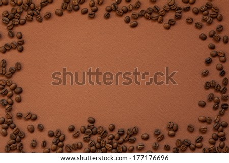 frame from coffee beans on brown paper