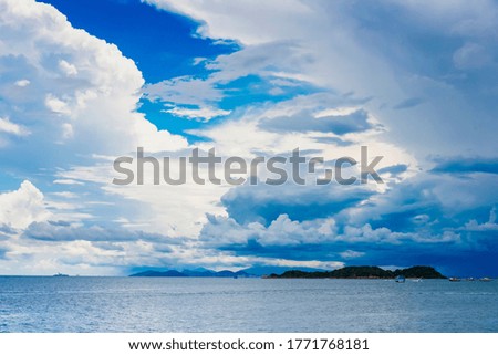The pictures of clear skies and beautiful clouds and the beach during the day time