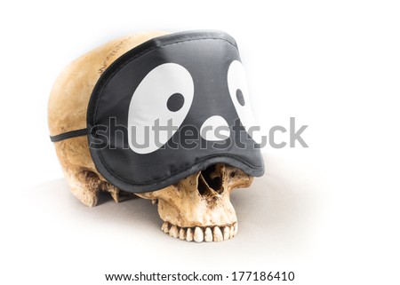 Human skull with funny eyepad