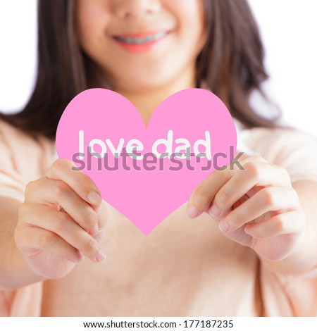 Woman holding pink heart with love dad