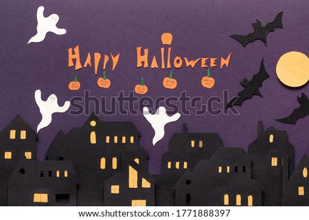 Modern gift card with halloween on dark background. Helloween in paper cut style on dark background. Happy halloween.
