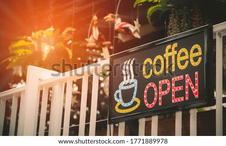open text with LED light on a signboard of a coffee shop