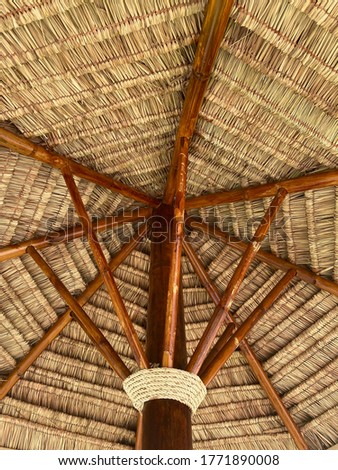 Background pictures of the house roof made of leaves and bamboo.