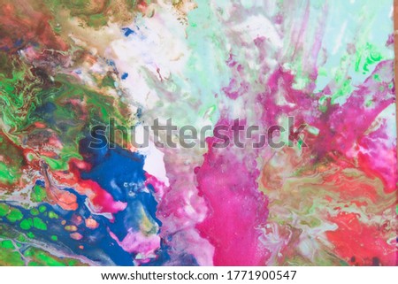 Abstract artistic background with spots of acrylic paint in various spring colors