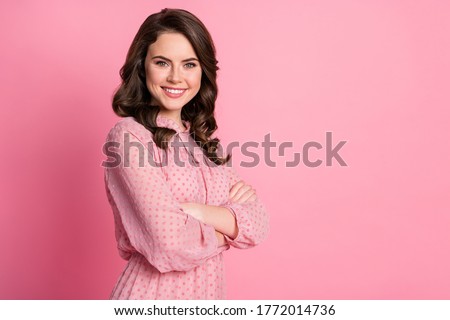 Profile side view portrait of her she nice-looking attractive lovely pretty cute winsome charming cheerful cheery content wavy-haired girl folded arms isolated over pink pastel color background
