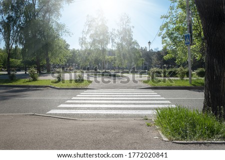 crosswalk on the road for safety when people walking cross the street, Crosswalk on the street for safety. empty crosswalk with sign Royalty-Free Stock Photo #1772020841