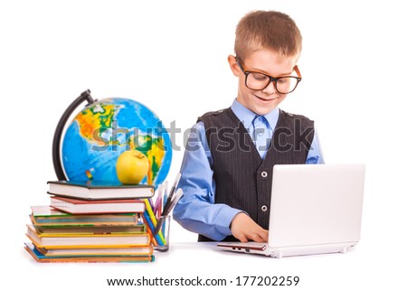 schoolboy with books and laptop on a white background