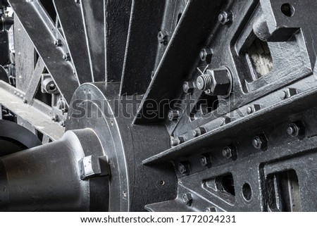 Wheel on a historic steam engine.