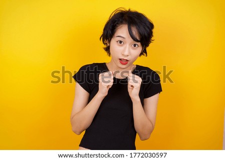Human face expressions and emotions. Portrait of young desperate woman looking panic, holding her hands near her face, with mouth wide open. Female in despair and shock