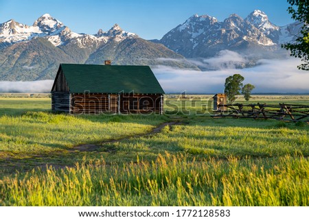 Rustic building, part of the historic Morman Row homestead in Antelope Flats, in Grand Teton National Park Wyoming, at sunrise Royalty-Free Stock Photo #1772128583