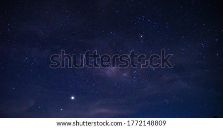 Panorama blue night sky milky way and star on dark background.Universe filled, nebula and galaxy with noise and grain.Photo by long exposure and select white balance.Dark night sky.