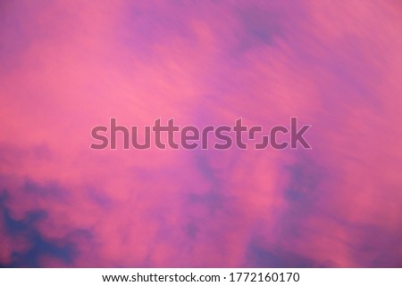 Beautiful blue sky with blur bright pink clouds