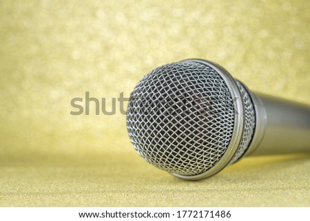Microphone on a yellow background..