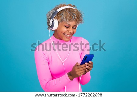 woman with mobile phone and headphones isolated on background