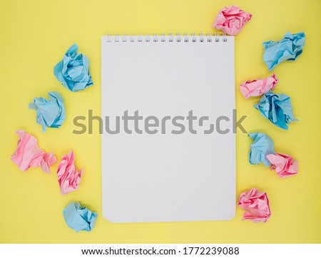 Creativity inspiration, ideas concept with crumpled paper ball on yellow background. Notepad with blank pages for copy space. Cards, business cards, invitations. Flat lay, copy space, top view. Royalty-Free Stock Photo #1772239088